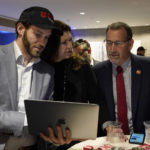 
              FILE - Republican gubernatorial candidate, state Sen. Brian Dahle, right, looks at early election returns with his wife, Assemblywoman Megan Dahle, center, on a laptop held by Erik Brahms, left, Megan Dahle's Assembly chief of staff, at an election night gathering in Sacramento, Calif., June 7, 2022. Dahle finished second in California's primary on June 7, and knows it will be hard to defeat incumbent Democratic Gov. Gavin Newsom. He plans to focus on what he says are the problems people care about the most, including high gas prices and rising crime. (AP Photo/Rich Pedroncelli, File)
            