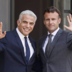 
              French President Emmanuel Macron, right, and Israel's Prime Minister Yair Lapid wave Tuesday, July 5, 2022 at the Elysee Palace in Paris. It was the first overseas trip by Yair Lapid since he took office last week. (AP Photo/Thomas Padilla)
            