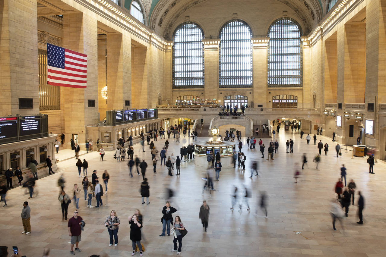FILE - Commuters pass through Grand Central Terminal on March 10, 2020 in New York. Millennials are...