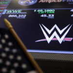 
              FILE - The logo for World Wrestling Entertainment, Inc., WWE, appears above a trading post on the floor of the New York Stock Exchange, Tuesday, Feb. 18, 2020.  Vince McMahon is voluntarily stepping back from his roles as CEO and chairman at WWE, Friday, June 17, 2022, as the sports entertainment company performs an investigation into alleged misconduct related to a relationship with a former employee.
 (AP Photo/Richard Drew, File)
            