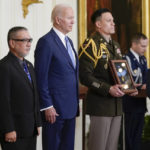
              President Joe Biden presents the Medal of Honor to Staff Sgt. Edward Kaneshiro for his actions on Dec. 1, 1966, during the Vietnam War, as his son John Kaneshiro accepts the posthumous recognition during a ceremony in the East Room of the White House, Tuesday, July 5, 2022, in Washington. (AP Photo/Evan Vucci)
            