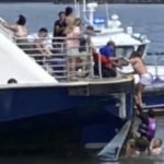 
              This photo provided by NY Waterway shows ferry personnel making rescue of individuals after a boat capsized in the Hudson River on Tuesday, July 12, 2022, in New York. (NY Waterway via AP)
            