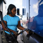 
              Delores Bledsoe, of Houston, Texas, fuels up her rig at a truck stop in Carlisle, Pa., Wednesday, July 13, 2022. (AP Photo/Matt Rourke)
            