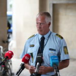 
              Copenhagen Police Chief Inspector Soeren Thomassen prepares to speak regarding the shooting at the Field's Shopping Center during press conference at the Police Station in Copenhagen, Denmark, Sunday, July 3, 2022.  Danish police said Sunday that several people were shot at a Copenhagen shopping mall, one of the largest in Scandinavia. Copenhagen police said that one person has been arrested in connection with the shooting at the Field’s shopping mall, which is close to the city's airport. Police tweeted that “several people have been hit,” but gave no other details. (Emil Helms /Ritzau Scanpix via AP)
            