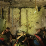 
              Ukrainian servicemen rest in a basement between fightings with Russian forces at the frontline in Kharkiv region, Ukraine, Wednesday, July 27, 2022. (AP Photo/Evgeniy Maloletka)
            