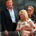 
              FILE - Donald Trump and his ex-wife Ivana Trump are seen together watching the men's singles finals match between Patrick Rafter and Greg Rusedski at the U.S. Open in New York Sunday, Sept. 7, 1997. Ivana Trump, the first wife of Donald Trump, has died in New York City, the former president announced on social media Thursday, July 14, 2022. (AP Photo/Rusty Kennedy, File)
            