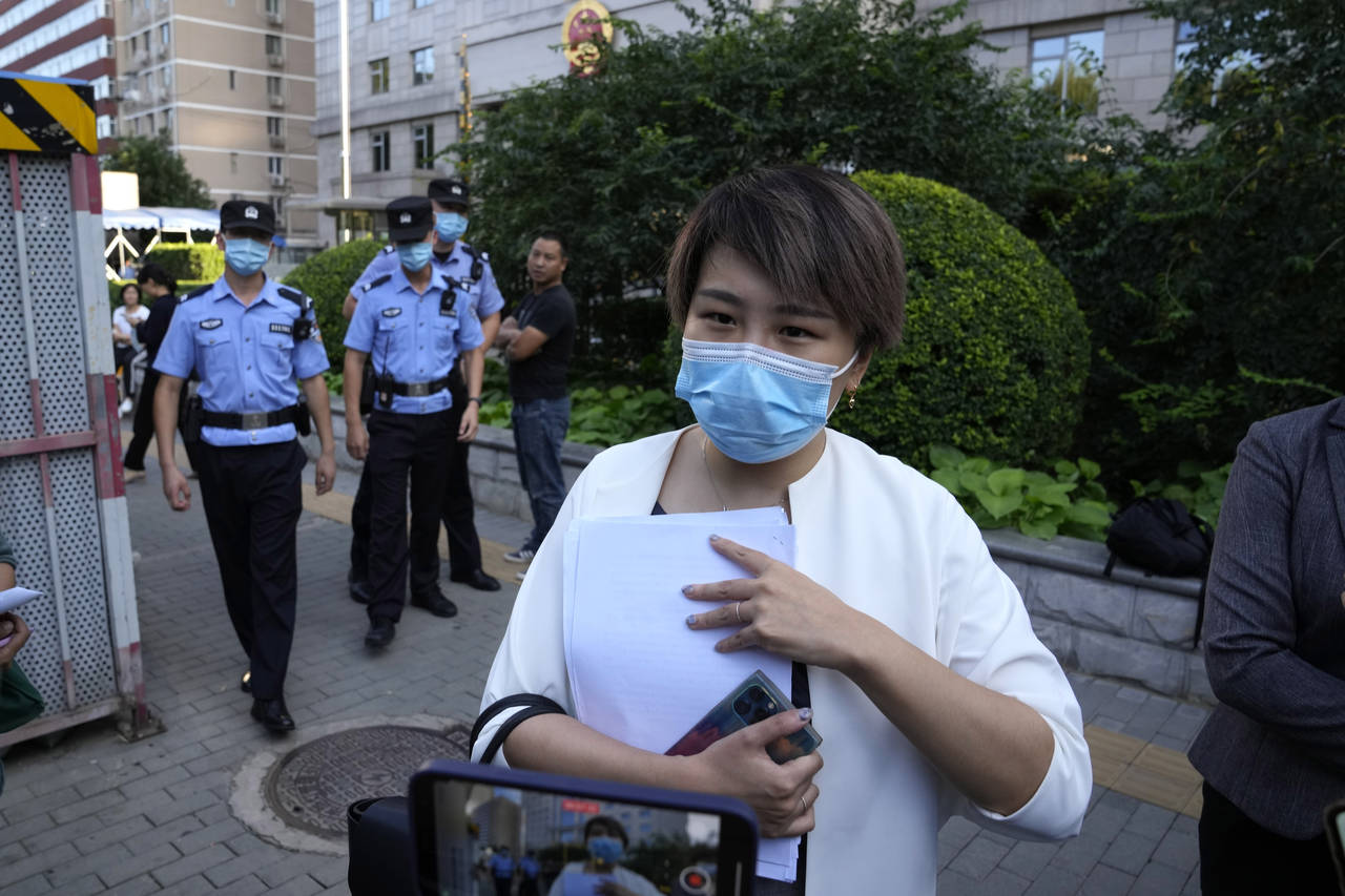 Teresa Xu speaks to journalists after her court session at the Chaoyang People's Court in Beijing, ...