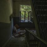 
              FILE - Damages inside an apartment building after a missile strike hit a residential area, in Kramatorsk, Donetsk region, eastern Ukraine, Thursday, July 7, 2022. Last week, the governor of the Donetsk oblast Pavlo Kyrylenko urged the province's more than 350,000 remaining residents to flee to safer towns further West, saying that evacuating the region was necessary to save lives and allow the Ukrainian army to better defend towns against a Russian advance. Many refuse to leave the city. (AP Photo/Nariman El-Mofty, File)
            