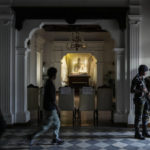 
              Army soldiers stand guard as protesters leave prime minister Ranil Wickremesinghe's office building in Colombo, Sri Lanka, Thursday, July 14, 2022. Sri Lankan protesters retreated from government buildings they seized and military troops reinforced security at the Parliament on Thursday, establishing a tenuous calm in a country in both economic meltdown and political limbo.(AP Photo/Rafiq Maqbool)
            