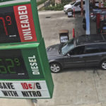 Gas prices are displayed at a gas station Friday, July 1, 2022, in Salt Lake City. (AP Photo/Rick Bowmer