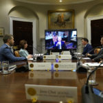 
              President Joe Biden, on screen at center, participates in a meeting with SK Group Chairman Chey Tae-won, fourth from right, from the Roosevelt Room of the White House in Washington, Tuesday, July 26, 2022. The meeting comes as the Biden administration is seeking the cooperation of Asian allies such as South Korea to reinforce supply chains for critical components such as semiconductors. (AP Photo/Susan Walsh)
            