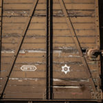 
              A train car symbolizing the Drancy camp, at the Shoah memorial, is photographed Tuesday, July 12, 2022 in Drancy, outside Paris. The Paris mayor and head of the French Holocaust Memorial will mark the 80th anniversary of the round-up of the Vel d'Hiv, the biggest Nazi roundup of Jews in France, visiting the site used as an internment camp during World War II for tens of thousands of people who were then sent on to Auschwitz and other death camps. (AP Photo/Thomas Padilla)
            