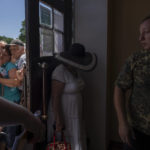 
              People who mostly refuse to evacuate their homes, wait in line to receive humanitarian food aid from the Kramatorsk city council, eastern Ukraine, Thursday, July 7, 2022. There are multiple reasons for residents' unwillingness to leave. Many are retirees, or from low-income families, who fear they would not be able to support themselves financially away from home. (AP Photo/Nariman El-Mofty)
            