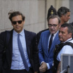 
              Actor Kevin Spacey, center, arrives at the Old Bailey, in London, Thursday, July 14, 2022. Spacey appeared Thursday in a court in London after he was charged with sexual offenses against three men. The 62-year-old Spacey is accused of four counts of sexual assault and one count of causing a person to engage in penetrative sexual activity without consent. (AP Photo/Frank Augstein)
            