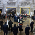 
              The flag-draped casket bearing the remains of Hershel W. “Woody” Williams is carried by joint service members into the to the U.S. Capitol Rotunda, Thursday, July 14, 2022, in Washington, to lie in honor.  Williams, the last remaining Medal of Honor recipient from World War II, died at age 98. (Tom Williams/Pool Photo via AP)
            