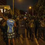 
              A protester shouts slogans as Army soldiers arrive from the site of a protest camp outside the Presidential Secretariat in Colombo, Sri Lanka, Friday, July 22, 2022. (AP Photo/Rafiq Maqbool)
            