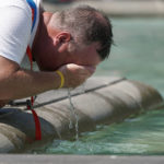 
              A man refreshes his face at a fountain in Trafalgar Square in central London, Tuesday, July 19, 2022. Britain shattered its record for highest temperature ever registered Tuesday, with a provisional reading of 39.1 degrees Celsius (102.4 degrees Fahrenheit), according to the country's weather office — and the heat was only expected to rise. (Aaron Chown/PA Wire/PA via AP)
            