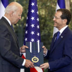 
              President Joe Biden receives the Israeli Presidential Medal of Honor from Israeli President Isaac Herzog, Thursday, July 14, 2022, in Jerusalem. (AP Photo/Evan Vucci)
            
