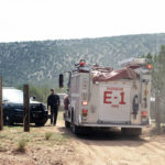 
              CORRECTS DATE TO SUNDAY, JULY 17,  2022, NOT MONDAY, JULY 18 2022 - A New Mexico State Police Officer mans a gate leading to the helicopter crash site, Sunday, July 17, 2022, near Las Vegas, N.M., about 123 miles (197 kilometers) northeast of Albuquerque. Four people have been killed in a crash of a Bernalillo County Sheriff’s Office helicopter that was headed back to Albuquerque after assisting firefighters in another New Mexico city, authorities said. (Adolphe Pierre-Louis/The Albuquerque Journal via AP)
            