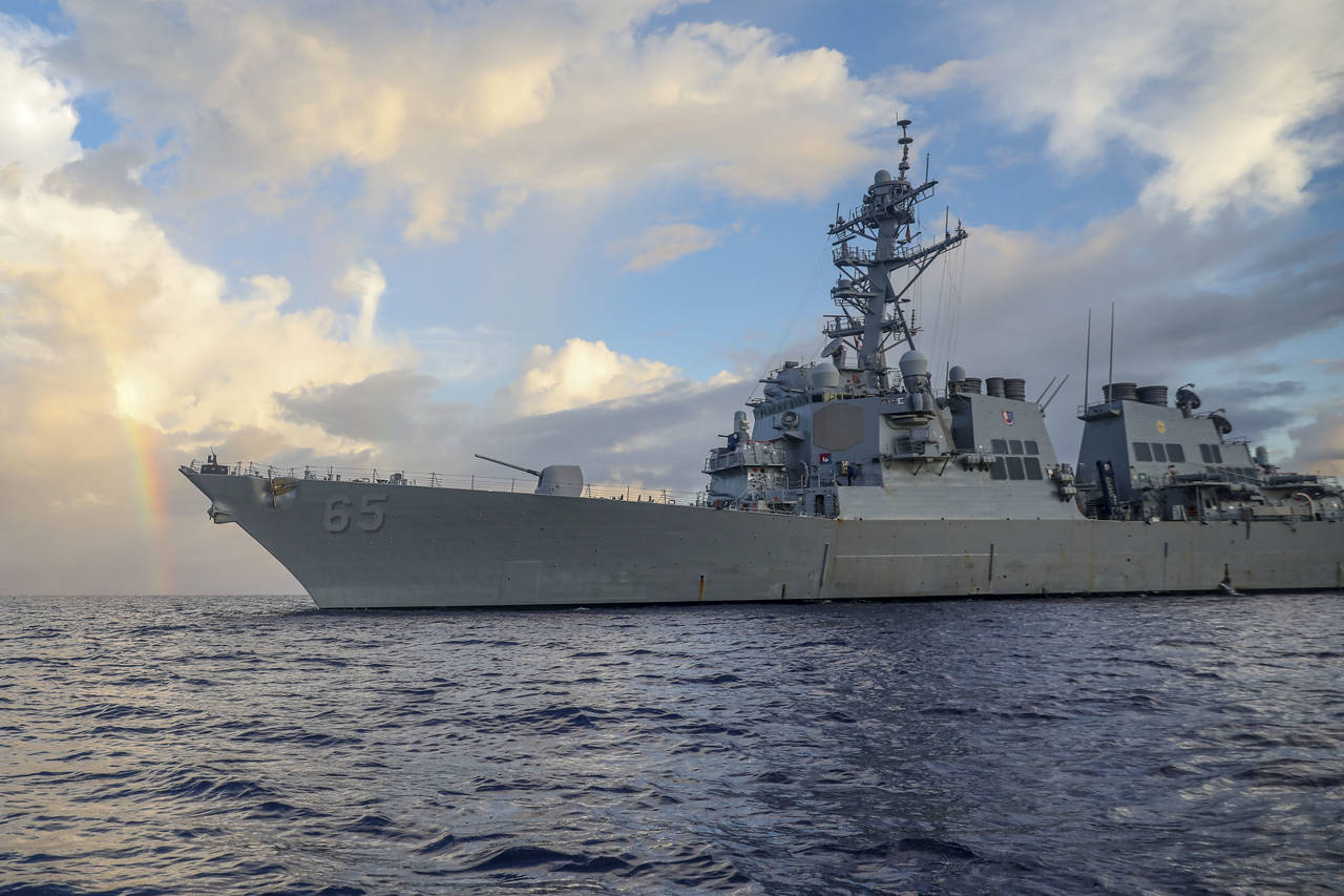 In this photo provided by U.S. Navy, Arleigh Burke-class guided-missile destroyer USS Benfold (DDG ...