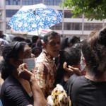 
              People queue up to enter the official residence of president Gotabaya Rajapaksa three days after it was stormed by anti government protesters in Colombo, Sri Lanka, Tuesday, July 12, 2022. Rajapaksa had vacated the building before the protesters came in. (AP Photo/Eranga Jayawardena)
            