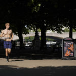 
              A man runs past an ice-cream sign, on the south bank of river Thames, in London, Monday, July 18, 2022. Britain’s first-ever extreme heat warning is in effect for large parts of England as hot, dry weather that has scorched mainland Europe for the past week moves north, disrupting travel, health care and schools. (AP Photo/Alberto Pezzali)
            