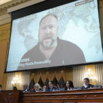 
              A video showing Alex Jones is shown as the House select committee investigating the Jan. 6 attack on the U.S. Capitol holds a hearing at the Capitol in Washington, Tuesday, July 12, 2022. (AP Photo/J. Scott Applewhite)
            
