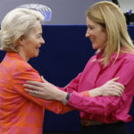 
              European Commission President Ursula von der Leyen, left, is greeted by European Parliament President Roberta Metsola at the European Parliament before the presentation of the programme of activities of the Czech Republic's presidency , Wednesday, July 6, 2022 in Strasbourg, eastern France. (AP Photo/Jean-Francois Badias)
            