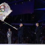 
              FILE - London mayor Boris Johnson, second from left, waves the Olympic flag as President of the International Olympic Committee Jacques Rogge, center, and Eduardo Paes, mayor of Rio de Janeiro look on during the Closing Ceremony at the 2012 Summer Olympics, Sunday, Aug. 12, 2012, in London. British media say Prime Minister Boris Johnson has agreed to resign on Thursday, July 7 2022, ending an unprecedented political crisis over his future. (AP Photo/Matt Dunham, File)
            