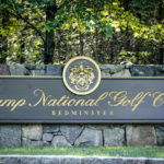 
              FILE - Signage for Trump National Golf Club is shown on approach to the entrance in Bedminster, N.J., on Oct. 2, 2020. A group of Sept. 11 victims' family members are condemning former President Donald Trump for hosting the Saudi-backed LIV golf tour at his New Jersey course later this month. (AP Photo/Seth Wenig, File)
            