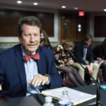
              FILE - Dr. Robert Califf gathers his documents as the Senate Committee on Health, Education, Labor and Pension adjourn a hearing on the nomination of Califf to be commissioner of the U.S. Food and Drug Administration on Capitol Hill in Washington, Tuesday, Dec. 14, 2021. Califf, now head of the FDA, says a comprehensive review of the opioid painkillers that triggered the nation's ongoing drug overdose epidemic is in the works. But he faces skepticism about the long-promised review from lawmakers, experts and advocates after years of delay. (AP Photo/Manuel Balce Ceneta, File)
            