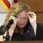 
              Marjory Stoneman Douglas High School teacher Dara Hass wipes away tears as she testifies in court about the shooting in her classroom during the penalty phase of Marjory Stoneman Douglas High School shooter Nikolas Cruz's trial at the Broward County Courthouse in Fort Lauderdale, Fla., on Tuesday, July 19, 2022. His brother, Nicholas Dworet was also shot, and was killed in the rampage. Cruz previously plead guilty to all 17 counts of premeditated murder and 17 counts of attempted murder in the 2018 shootings.  (Mike Stocker/South Florida Sun Sentinel via AP, Pool)
            