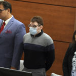 
              Marjory Stoneman Douglas High School shooter Nikolas Cruz stands with Chief Assistant Public Defender David Wheeler and sentence mitigation specialist Kate O'Shea, during the penalty phase of Cruz's trial at the Broward County Courthouse in Fort Lauderdale on Wednesday, July 27, 2022. Cruz previously plead guilty to all 17 counts of premeditated murder and 17 counts of attempted murder in the 2018 shootings. (Mike Stocker/South Florida Sun Sentinel via AP, Pool)
            