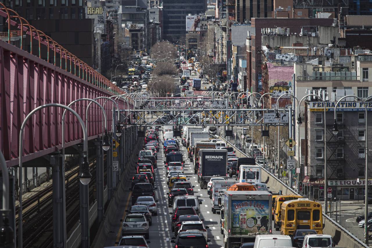 FILE - Congested traffic from Brooklyn enters Manhattan off the Williamsburg Bridge, March 28, 2019...