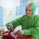 
              A woman cast her vote at a polling station in Tunis, Tunisia, Monday, July 25, 2022. Tunisians head to the polls Monday to vote on a new constitution. (AP Photo/Hassene Dridi)
            