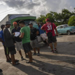 
              Drivers sign up on a list to wait their turn to fuel up their vehicles at a gas station in Bacuranao near Havana, Cuba, Thursday July 14, 2022. (AP Photo/Ramon Espinosa)
            