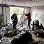 
              In this photo provided by the Ukrainian Emergency Service, first responders work in a damaged residential building in Odesa, Ukraine, early Friday, July 1, 2022, following Russian missile attacks. Ukrainian authorities said Russian missile attacks on residential buildings in the port city of Odesa have killed more than a dozen people. (Ukrainian Emergency Service via AP)
            