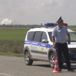 
              In this image taken from video provided by the RU-RTR Russian television on Tuesday, Aug. 16, 2022, a policeman blocks a way to the site of explosion at an ammunition storage of Russian army near the village of Mayskoye, Crimea. Explosions and fires ripped through an ammunition depot in Russian-occupied Crimea on Tuesday in the second suspected Ukrainian attack on the peninsula in just over a week, forcing the evacuation of more than 3,000 people. (RU-RTR Russian Television via AP) RUSSIA OUT
            