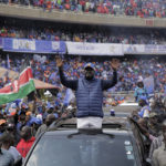 
              Kenyan presidential candidate Raila Odinga waves to his supporters as he arrives at his final electoral campaign rally in Kasarani stadium in Nairobi, Kenya Saturday, Aug. 6, 2022. Kenya is due to hold its general election on Tuesday, Aug. 9 as the East Africa's economic hub chooses a successor to President Uhuru Kenyatta. (AP Photo/Brian Inganga)
            