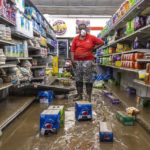
              Gwen Christian stands in an aisle at the Isom IGA in Isom, Ky., on Monday, Aug. 1, 2022. Christian began working at the store as a cashier months after it first opened in 1973. She now owns the store with her husband, Arthur. Last week, historic floods ravaged the store. (Ryan C. Hermens/Lexington Herald-Leader via AP)
            