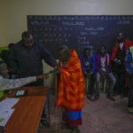 
              Residents line up to vote at the Oltepesi Primary School in Kajiado County, Nairobi, Kenya, Tuesday Aug. 9, 2022. Kenyans are voting to choose between opposition leader Raila Odinga and Deputy President William Ruto to succeed President Uhuru Kenyatta after a decade in power. (AP Photo/Ben Curtis)
            