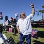 
              FILE - Republican gubernatorial candidate Loren Culp smiles while greeting supporters as he arrives at a rally Aug. 29, 2020, in Mount Vernon, Wash. Republican Rep. Dan Newhouse, who voted to impeach Donald Trump over the Jan. 6 insurrection, appeared well positioned Friday, Aug. 5, 2022, to advance to the general election in his Washington state primary. Newhouse, the four-term incumbent in the 4th Congressional District in central Washington, had about 26% of the vote. Culp, a Trump-endorsed former small town police chief who lost the 2020 governor’s race to Democrat Jay Inslee, was at about 21 21%. (AP Photo/Elaine Thompson, File)
            