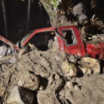
              In this photo released by the Siskiyou County Sheriff's Office is the washed away pick up truck of a private contractor who was aiding the firefighting efforts near Klamath River, Calif., Tuesday, Aug. 2, 2022. Amid storms Tuesday the contractor was hurt when a bridge gave out and washed his pickup truck away, said Courtney Kreider, a spokesperson with the Siskiyou County Sheriff's Office. The McKinney Fire was still out of control on Wednesday despite some progress by firefighters who took advantage of thunderstorms that dumped rain and temporarily lowered heat in the parched region. (Siskiyou County Sheriff's Office via AP)
            