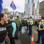 
              Freedom and Rights Coalition protesters demonstrate outside Parliament in Wellington, New Zealand, Tuesday, Aug. 23, 2022. About 2,000 protesters upset with the government's pandemic response converged on New Zealand's Parliament — but it appeared there would be no repeat of the action six months ago in which protesters camped out on Parliament grounds for more than three weeks. (George Heard/New Zealand Herald via AP)
            