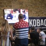 
              People attend the watch party of Kansas Attorney General candidate Kris Kobach at the Celtic Fox Irish Pub and Restaurant in Topeka, Kan., on Tuesday, Aug. 2, 2022. (Chance Parker/The Topeka Capital-Journal via AP)
            
