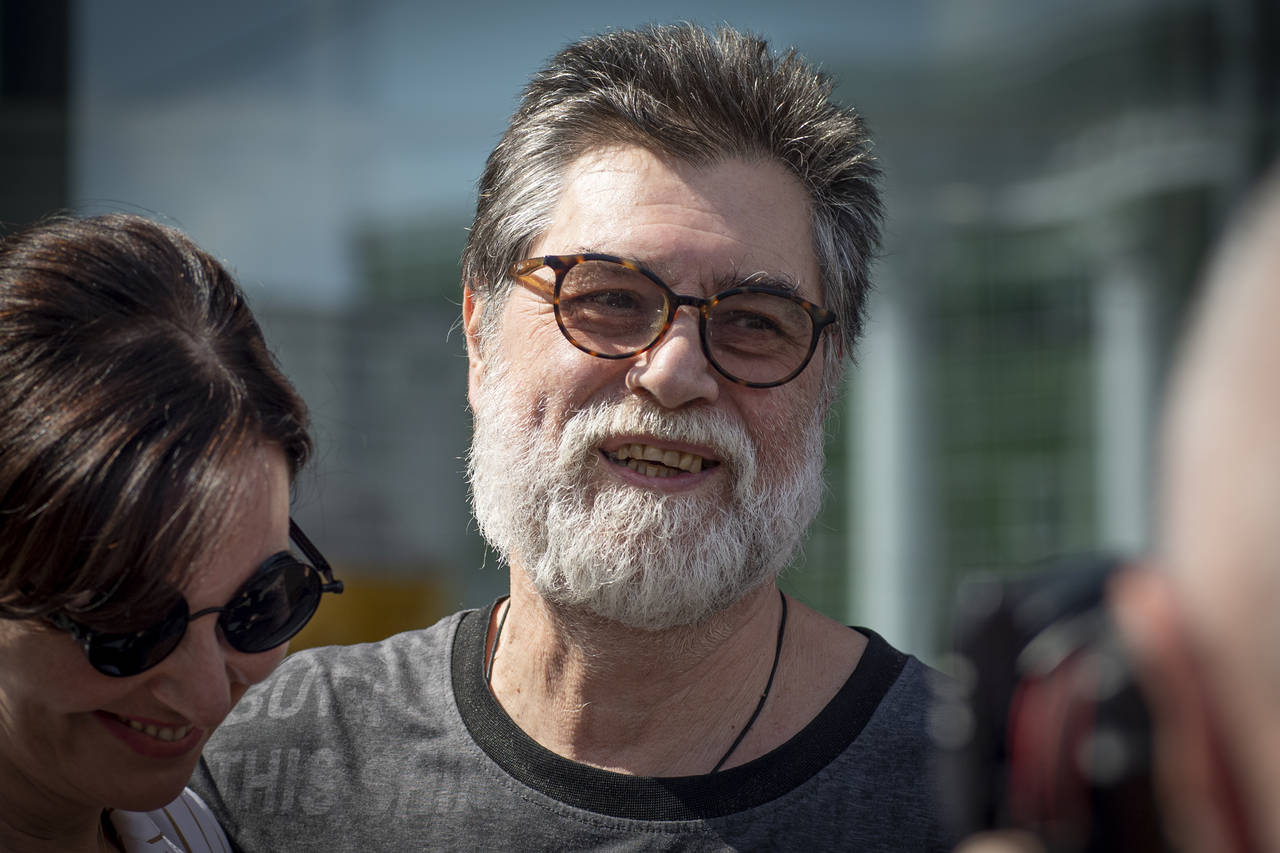 Sergei Zuyev, the rector of the Moscow School of Social and Economic Sciences, smiles as he leaves ...