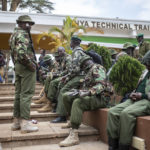 
              Security forces gather at a collection and tallying center in Nairobi, Kenya Wednesday, Aug. 10, 2022. Kenyans are waiting for the results of a close but calm presidential election in which the turnout was lower than usual. (AP Photo/Mosa'ab Elshamy)
            