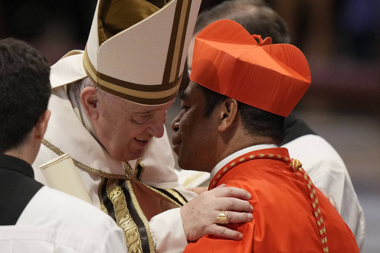 New Cardinal Virgilio Do Carmo Da Silva receives the red three-cornered biretta hat from Pope Franc...