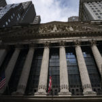 
              FILE - Statues adorn the facade of the New York Stock Exchange, July 14, 2022, in New York.  Stocks are opening lower on Wall Street, putting the S&P 500 index on track to break a four-week winning streak. The benchmark index was off 0.9% in the early going Friday, Aug. 19.  (AP Photo/John Minchillo, File)
            