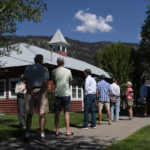 
              People wait in line to vote during the Republican primary election in Wilson, Wyo., Tuesday, Aug. 16, 2022.  Rep. Liz Cheney, a leader in the Republican resistance to former President Donald Trump, is fighting to save her seat in the U.S. House on Tuesday as voters weigh in on the direction of the GOP. (AP Photo/Jae C. Hong)
            